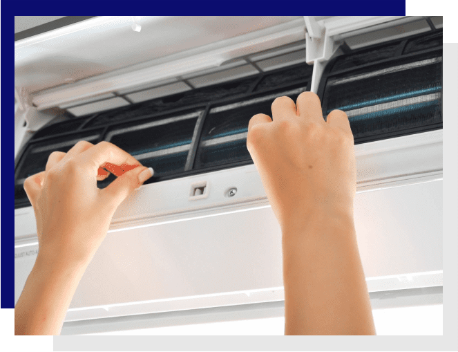 A person is holding a screwdriver and pointing to the air conditioner.