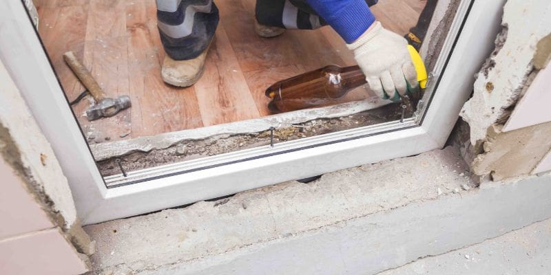 A person with gloves on and holding tools.